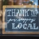 Chalkboard slate that says thank you for shopping local